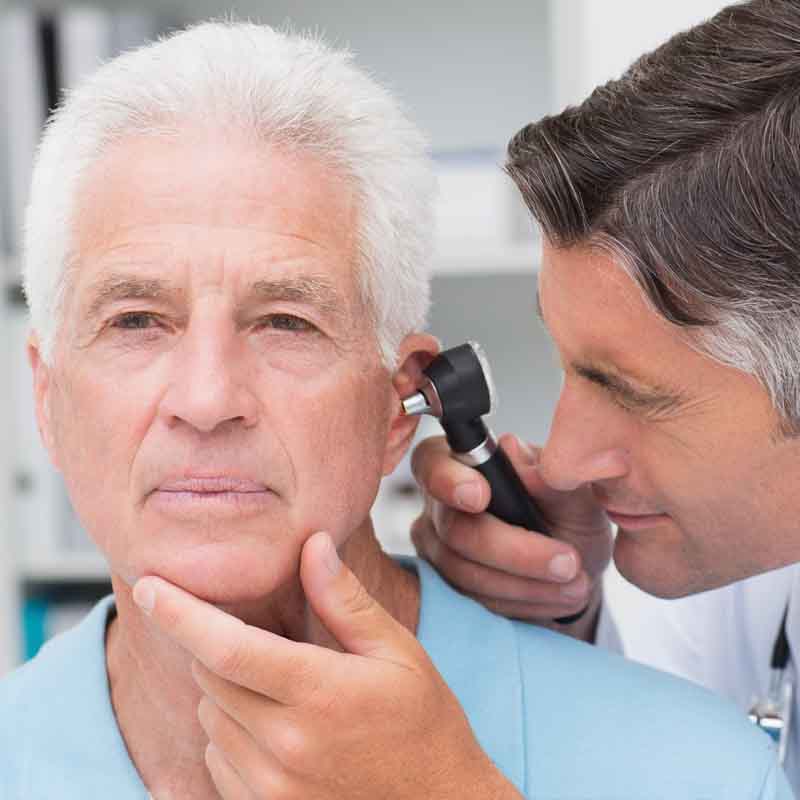 Man getting his ear examined
